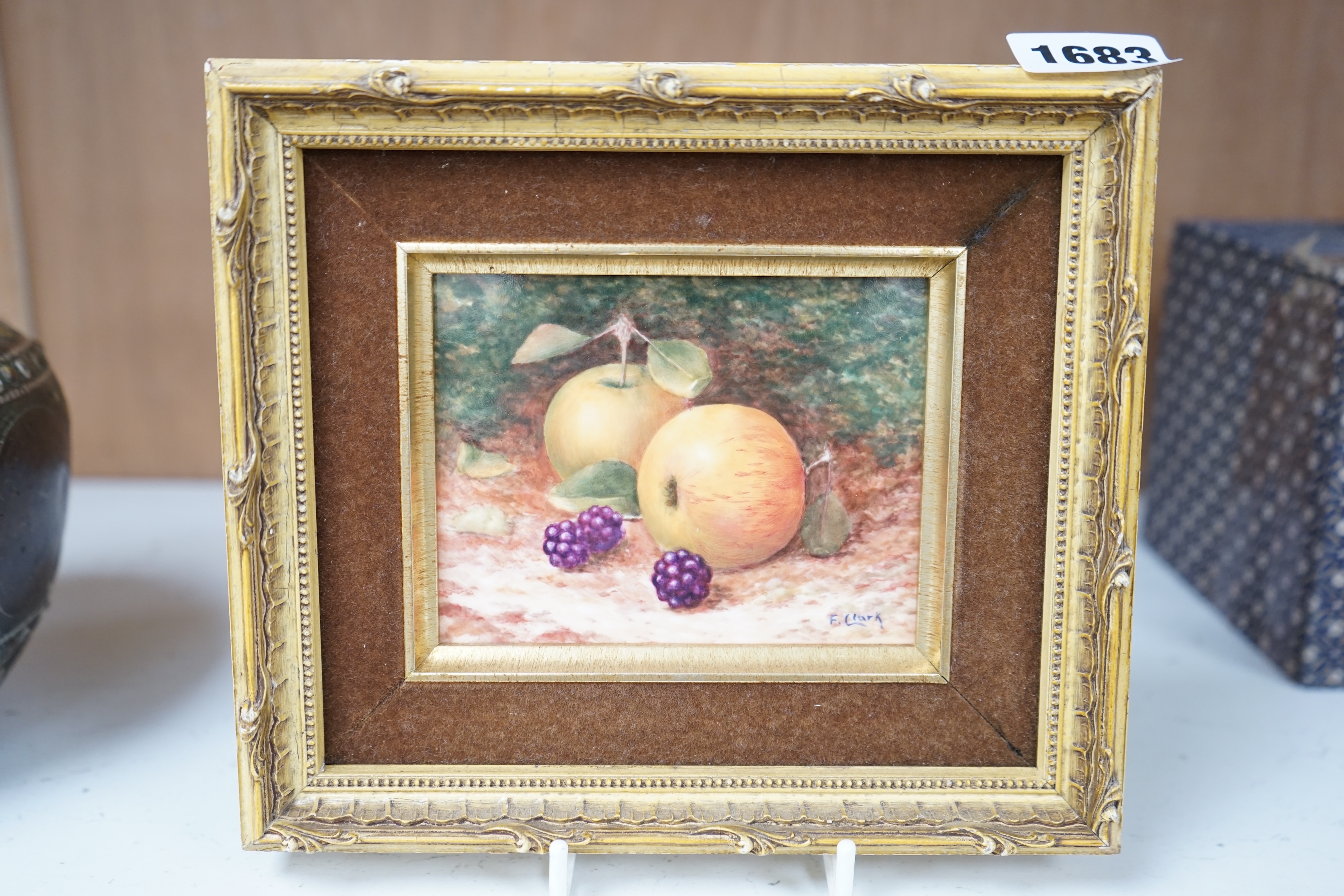 F. Clark (Royal Worcester artist, 20th. C), ceramic plaque, Still life of fruit, signed, 8 x 10.5cm, gilt framed. Condition - good